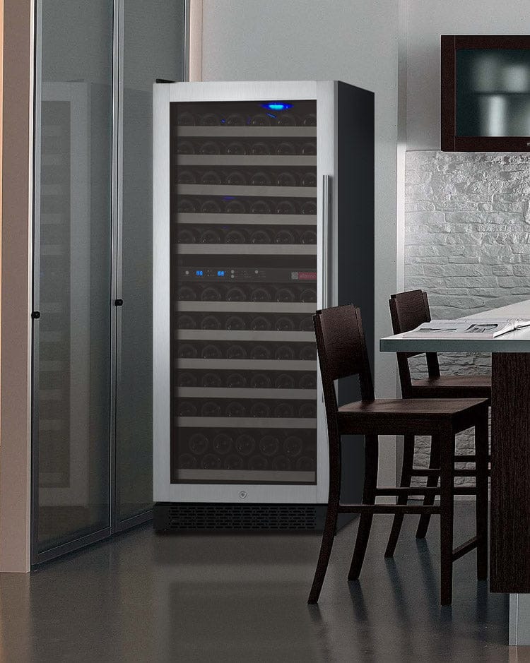 Allavino 121 Bottle Dual Zone 24 Inch Wide Wine Cooler placed in a dining area.