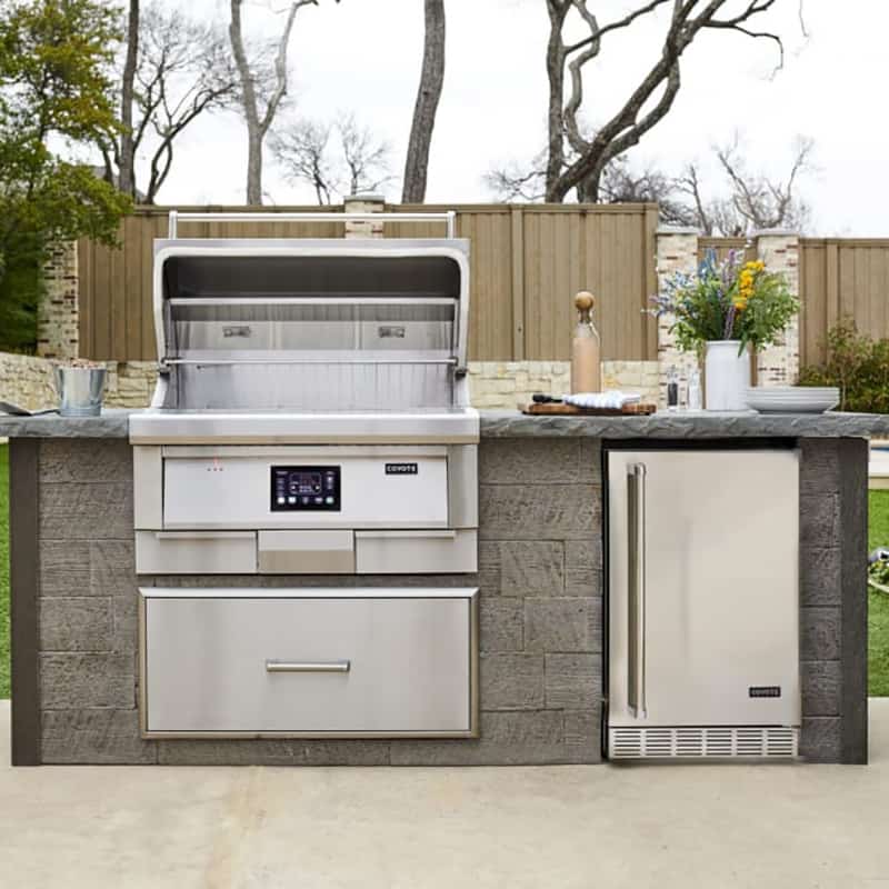 Coyote 36 Inch Electric Pellet Grill Built into Outdoor Kitchen
