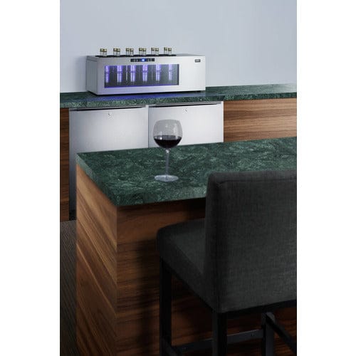 Summit 12 Bottle Single Zone Upright Wine Cooler placed into kitchen.